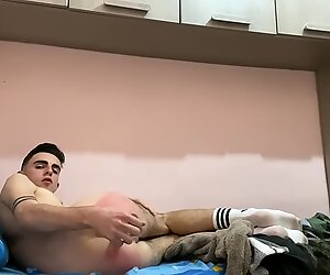 Solo video of a skinny white man poking his ass while masturbating