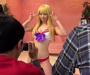 Japanese blonde goes naked and allows the guys to cum on her tits